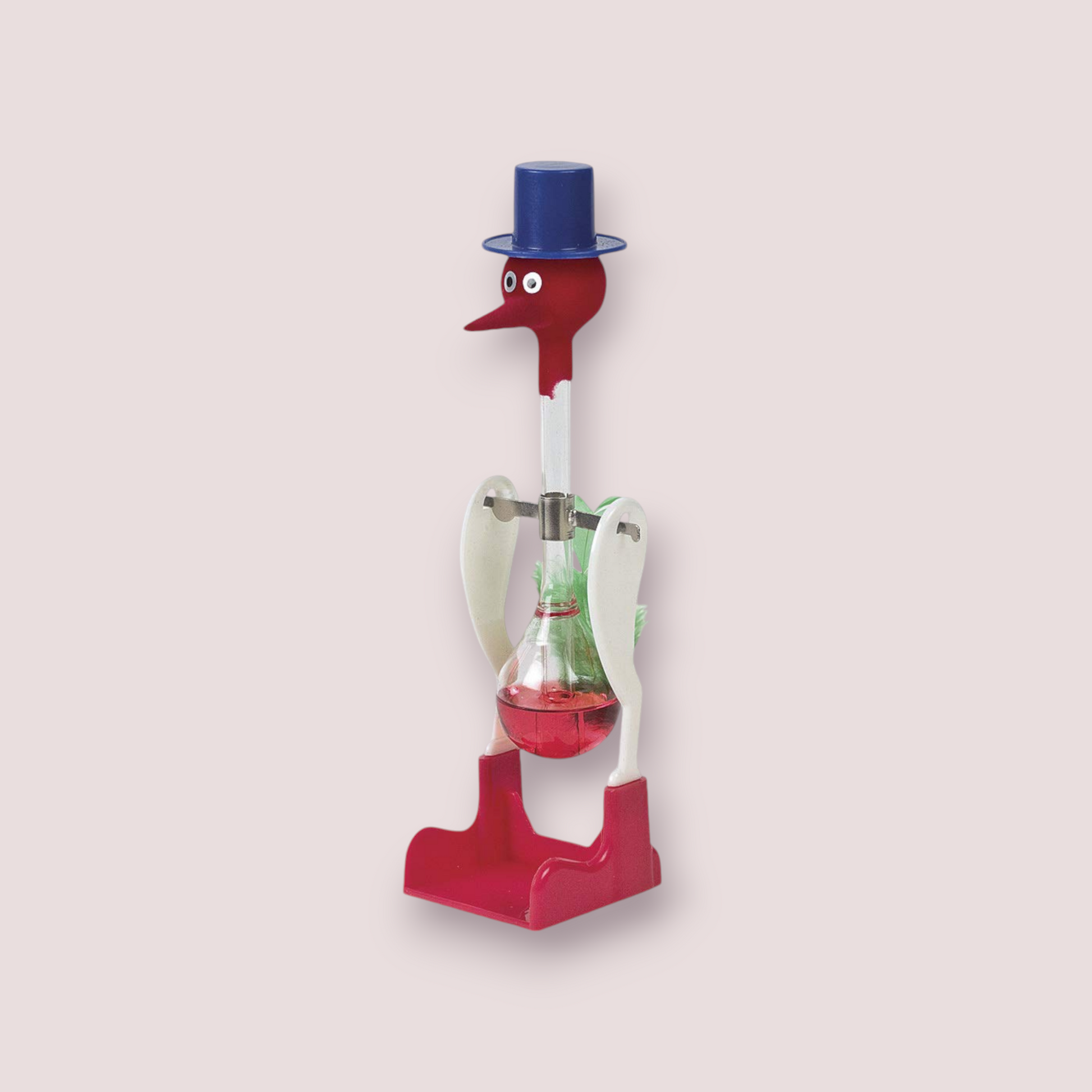 Original Drinking Bird toy featuring a red and white color scheme with a blue top hat. The bird has a clear glass tube body filled with a red liquid, which dips into the beak when activated. The base and head of the bird are red, while the midsection is white, creating a striking contrast. This classic novelty item is both amusing and fascinating to observe as it perpetually ‘drinks’ from a cup when set up properly.